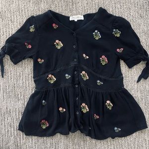 Women’s small black floral embroidered blouse.